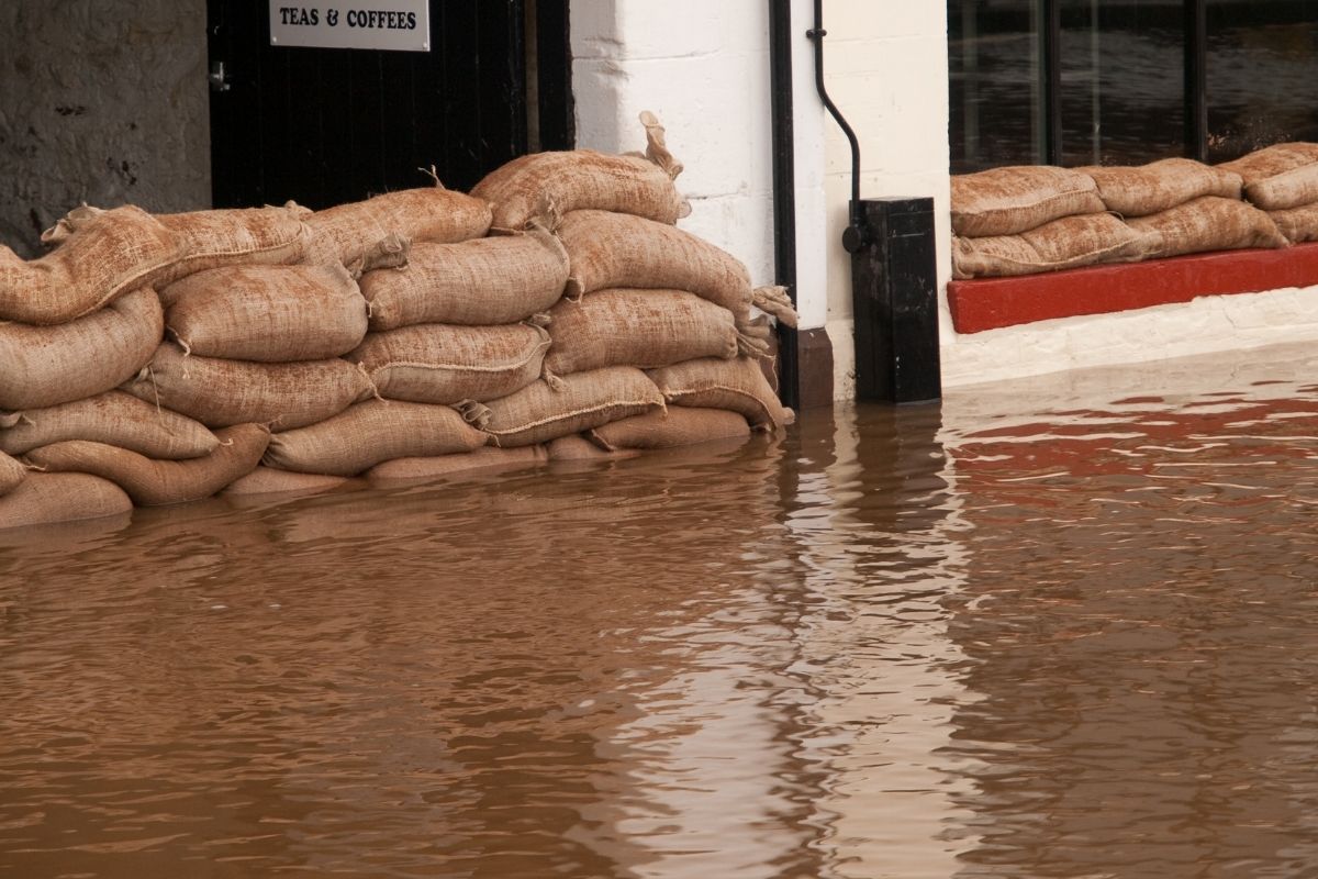 brown hemp sand bags protecting UK shop doorway as a flood defence